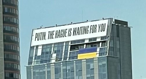 Putin The Hague is waiting for you banner 